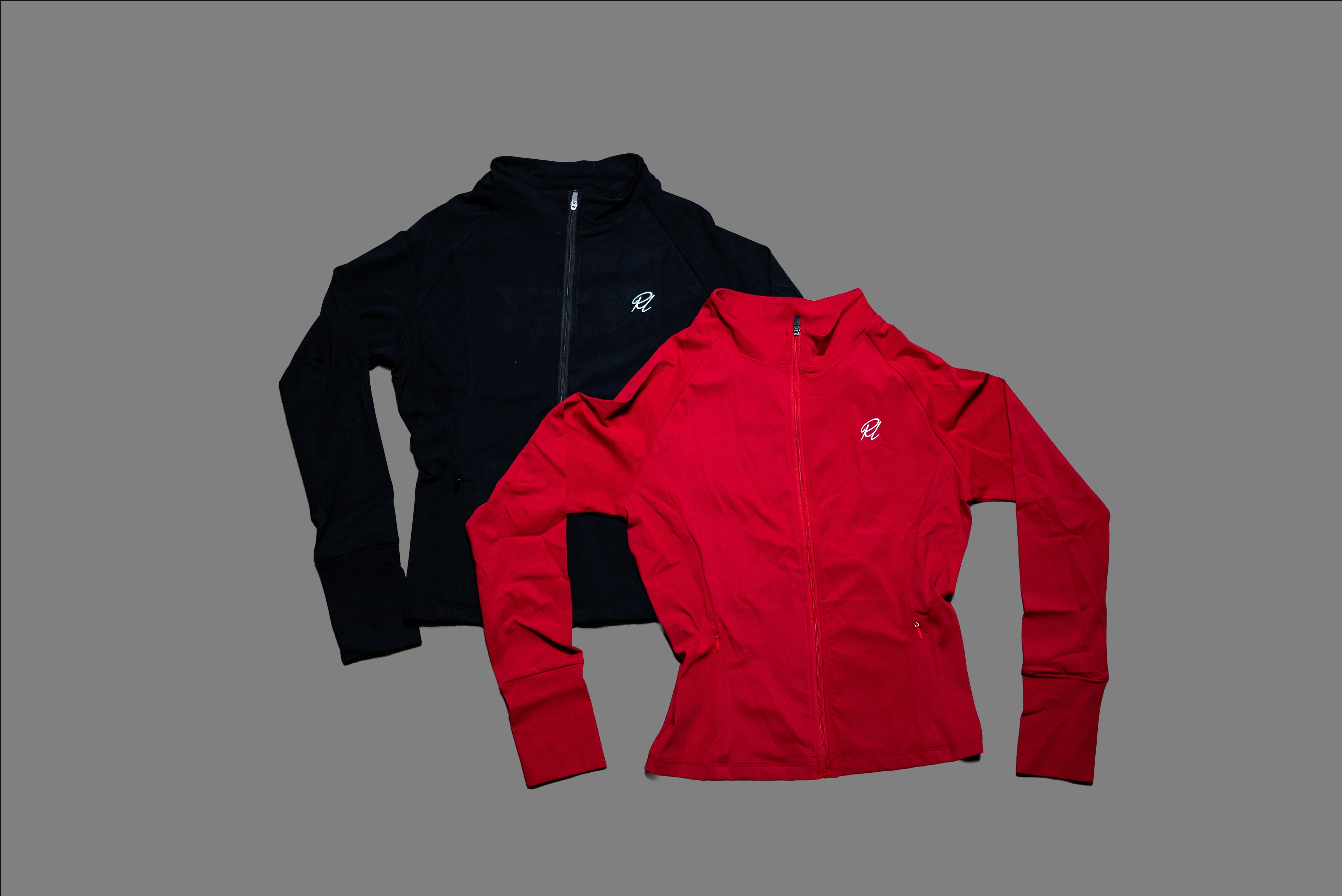 Black and red jackets with a brand logo on a gray background